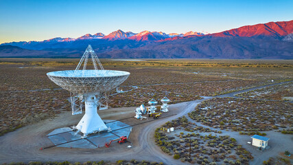 Aerial Owens Valley Radio Observatory Array with Snowy Mountain Sunrise California