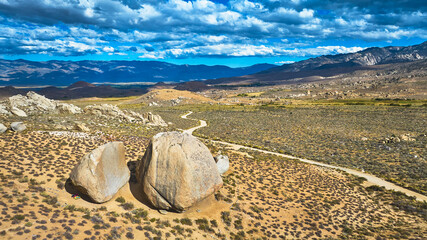 Aerial Buttermilk Boulders Road and Sierra Nevada Mountains in Vast California Landscape © Nicholas J. Klein