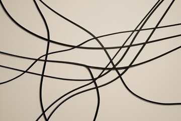 Black lines flow freely on a light background, forming an abstract visual