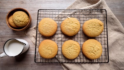 freshly baked sugar cookies on wire cooling rack overhead top view on linen towel homemade baking