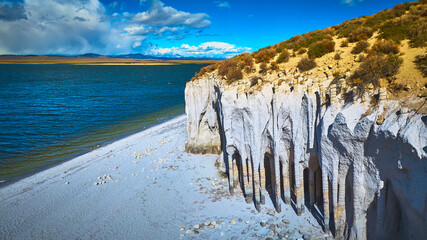 Aerial Crowley Lake Stone Columns and Blue Water with Rugged California Shoreline