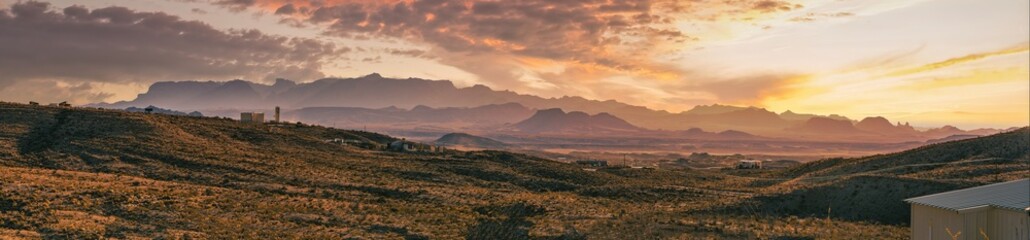 A dramatic sunset illuminates the Chisos Mountains in Texas.