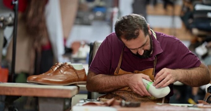 Artisan Shoemaker Meticulously Measures a Shoe Last in His Traditional Workshop for Custom Footwear