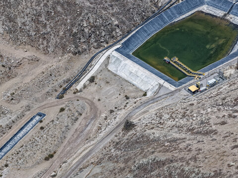 Geomembrane pond for groundwater monitoring for contamination prevention near mine