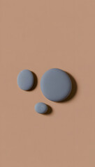 Minimal rock collection: three smooth river stones, varying sizes, matte gray, top-down, no shadow