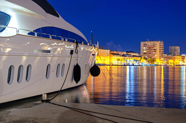 Yacht docks at sunset