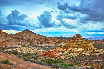 Muddy Mountain Dramatic Sandstone Formations and Desert Valley Under Stormy Sky