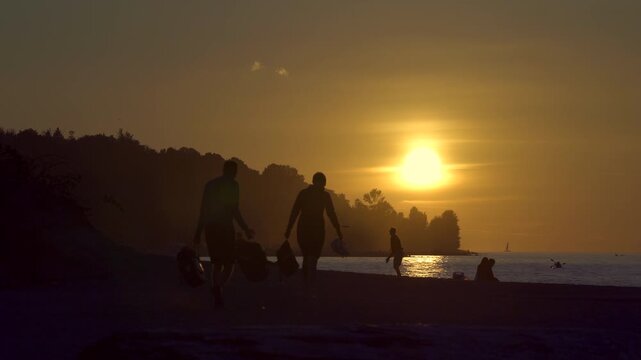 Spanish Banks Vancouver Sunset Activities 4K UHD.People playing on Jericho Beach and the Salish Sea during sunset, Vancouver. 4K UHD.
