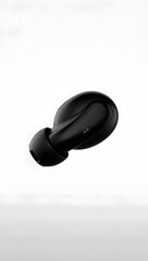 Transparent PNG: single modern wireless earbud, matte black, floating, isolated on white, clean edges
