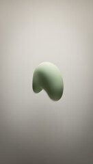Soft organic blob: muted sage green, blurred edges, floating on warm gray, zero detail, calming