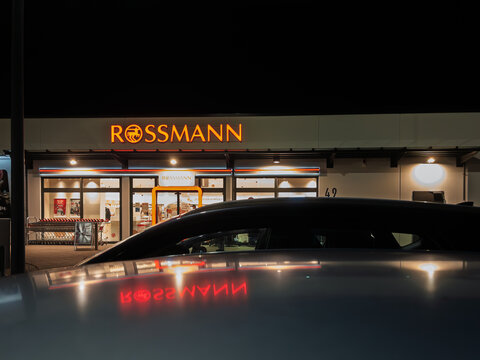 Rossmann Store Front at Night with Illuminated Signage