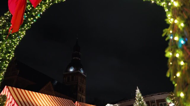 Festive evening fair, Evening holiday bazaar illuminated by colorful lights and textured reflections slow motion