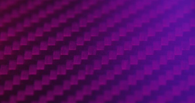 Close-up slide over the real carbon fiber texture background. Coloured light.