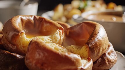 Delicious goldenbrown Yorkshire puddings freshly baked and served hot a classic British side dish perfect for a traditional roast dinner or festive meal showcasing their fluffy texture and crispy edg.