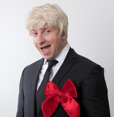 senior man holding a gift. Man gift. Male. People. Christmas photo. Holidays