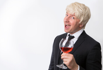 Portrait of handsome man with a glass of red wine. Alcohol. Red wine. Photo. Male