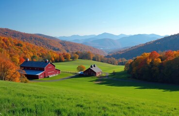 Red barns sit on a bright green hill with colorful autumn trees in the background. Mountains rise in hazy blue layers under a clear sky. The peaceful farm scene offers a tranquil rural outlook.
