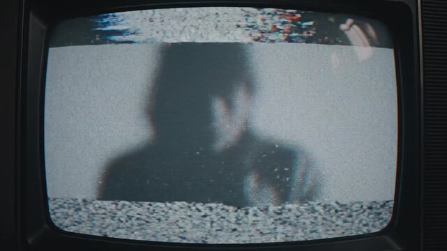 Static vintage television displaying abstract patterns