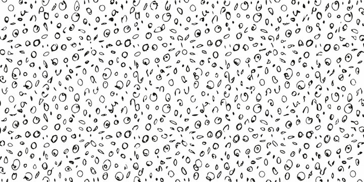 Abstract black and white pattern of scattered random circular shapes
