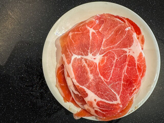 Pork slide in the plate for cooking in shabu pot