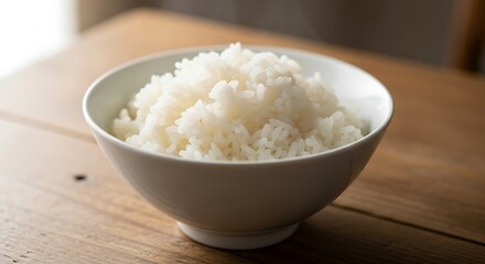 Steaming White Rice in a Ceramic Bowl on a Wooden Surface Table