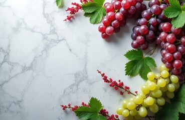 Ripe red and green grapes with leaves and red blossoms arranged on white marble. Provides ample copy space for text or design elements. Offers fresh, natural, and rustic aesthetic.