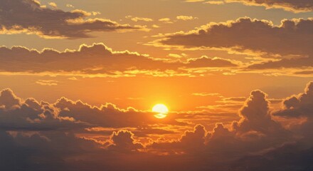 Golden sun setting through fluffy clouds
