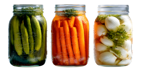 Assorted pickled vegetables in glass jars isolated on white background