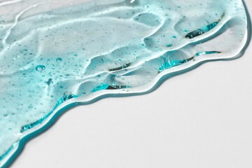 Microscopic view of a textured glass or crystal surface with wavy patterns