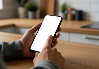 Person holds a smartphone with a blank white screen, perfect for showcasing mobile apps or digital content, highlighting personal technology and interactive connectivity