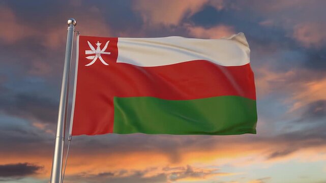 Oman's national flag waving against vibrant sunset sky