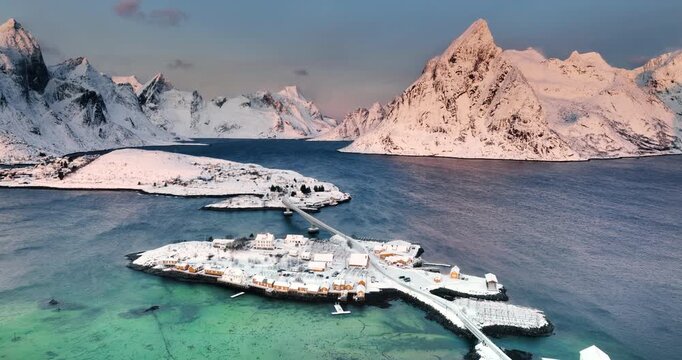 Aerial view Lofoten Islands, Norway panorama of Fredvang Bridge and nordic village, rocky sea shores and snowy mountains peaks spectacular landscape 
