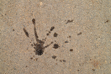 Concrete Surface with Handprint Stain. Concrete surface featuring dark handprint stain and rough texture. Perfect for conceptual and grunge designs.