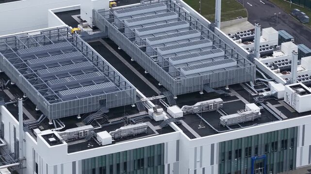Close up aerial video of large cooling systems and emergency backup generators at a Berlin data center, highlighting AI hardware, big data processing, and industrial scale computing infrastructure.