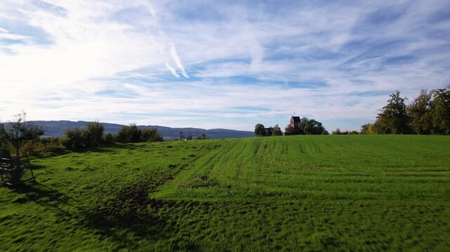Flying between apple trees and revealing the city Uster, Switzerland