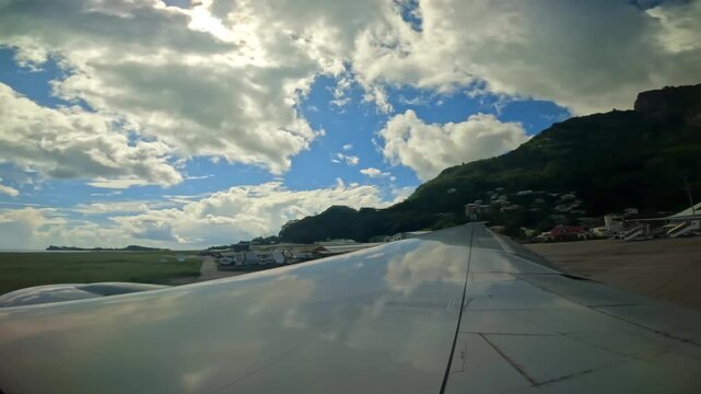 Plane taxiing for takeoff, wing view of emirates flight from Seychelles to Dubai, 25fps 002