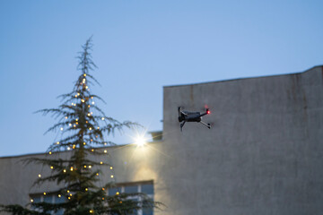 Drone approaches the top of a Christmas tree