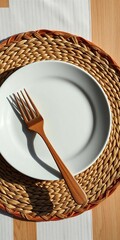 White plate on woven placemat with wooden fork, subtle shadow,  tabletop,  wood