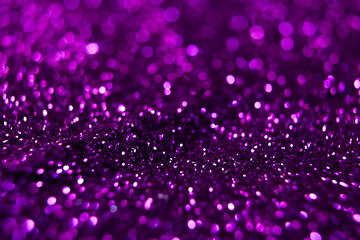 Purple glitter bokeh abstract background for Christmas and New Year.