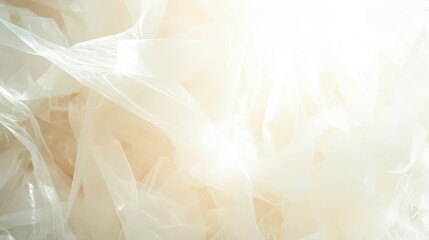 Abstract close up of a pile of heavy duty white plastic sheeting draped and folded showing translucent textures and light effects