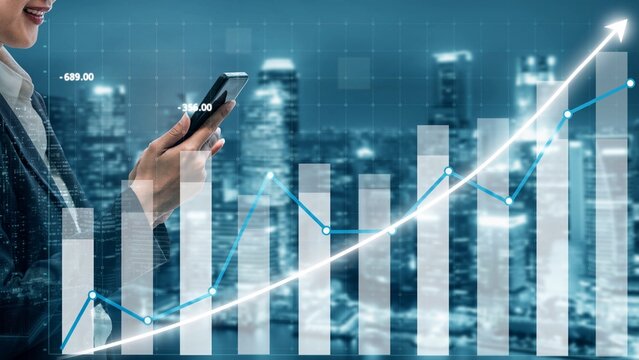 A businesswoman uses her smartphone while a graph illustrating growth trends illuminates the city skyline at night, symbolizing financial success and investment insight. Copula - Powered by Adobe