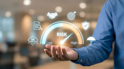 Businessman holding digital risk assessment gauge icon for security management,insurance and financial protection planning,safety level analysis,investment control,business analytics
