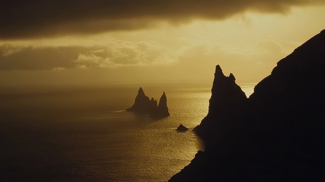 Silhouette of rocky coastline eroded by powerful ocean waves - Powered by Adobe
