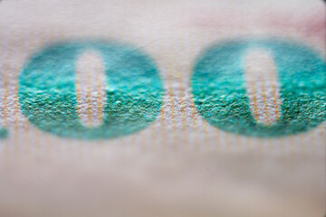 Close-Up of Printed Numbers on Currency Note with Detail Effects