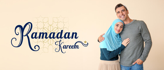 Portrait of Muslim couple on light background