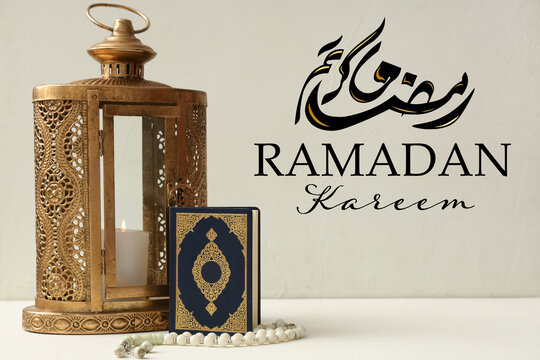 Lantern with burning candle, Koran and prayer beads on white grunge background