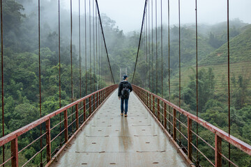 Suspension bridge in the forest on a cloudy day - Sapa, Vietnam