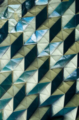 Folded spray painted colorful paper art, Japanese origami background texture, abstract geometric pattern artwork