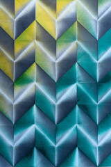Folded spray painted colorful paper art, Japanese origami background texture, abstract geometric pattern artwork
