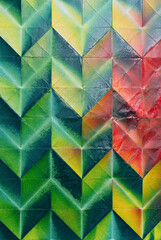 Folded spray painted colorful paper art, Japanese origami background texture, abstract geometric pattern artwork